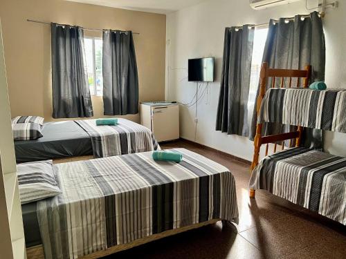 Ένα ή περισσότερα κρεβάτια σε δωμάτιο στο Da Praia Hotel