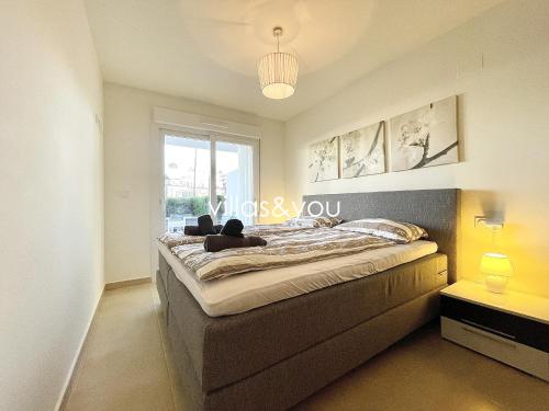 En eller flere senge i et værelse på Linnea Sol by Villas&You