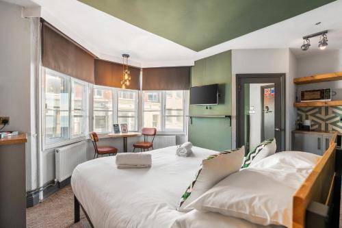 a bedroom with a large white bed in a room at One Broad Street in Brighton & Hove