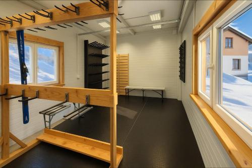 a sauna with a room with shelves and a window at Domek Zieleniec I Komfortowy Dom z Sauną dla Dużej Grupy przy Górskich Szlakach in Duszniki Zdrój