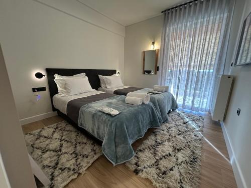 Postel nebo postele na pokoji v ubytování SOTERIO GRAND SUITE by PROJECT 86 IKE