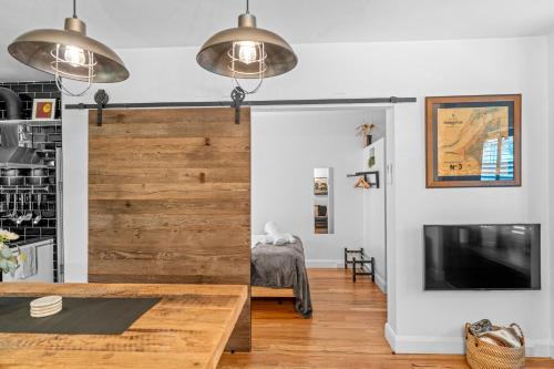 a living room with a sliding barn door at Industrial Central Apartment - Shop 8 in Fremantle