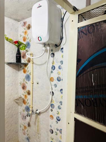 a shower in a bathroom with a shower at Next Home Stay in Nalkhera