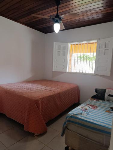 Ένα ή περισσότερα κρεβάτια σε δωμάτιο στο Casa de Maria - Tamandaré