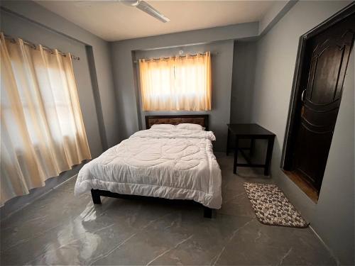 Postel nebo postele na pokoji v ubytování Amelie Apartments and Stay Inn