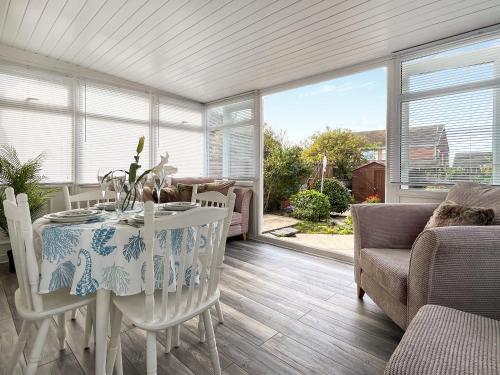 a dining room with a table and chairs at Roselynne in Redcar
