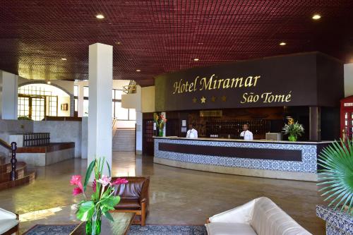 a lobby of a shopping center with a restaurant at Pestana Miramar São Tomé in São Tomé