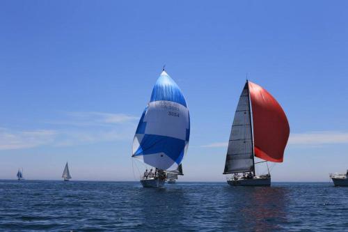 three sailboats in the ocean on the water at LifeHarbour Limanu in Limanu