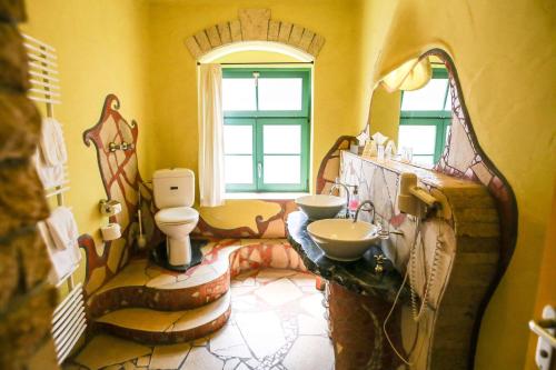 a bathroom with a toilet and a sink at Backstage Hotel in Dresden