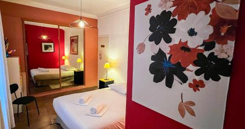 Ένα ή περισσότερα κρεβάτια σε δωμάτιο στο Au coeur d 'Avignon-Bonneterie