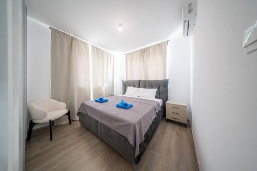 Ένα ή περισσότερα κρεβάτια σε δωμάτιο στο Serene Gardens 2BR w Pool & Gym