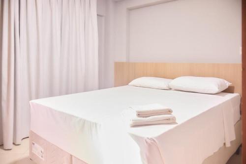 Ένα ή περισσότερα κρεβάτια σε δωμάτιο στο Apartamento Completo Quarto/ Sala/Cozinha/ Banheiro Mobiliado - WS Urban Ed. Celita Franca