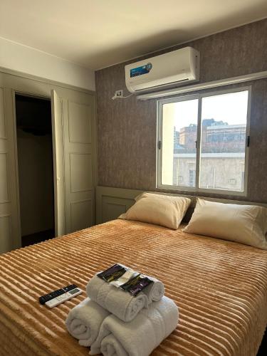 En eller flere senge i et værelse på Corrientes Premium