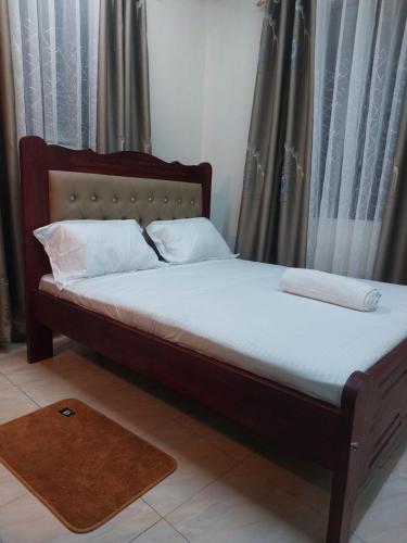 En eller flere senge i et værelse på Poshpalace homes, Mombasa CBD,