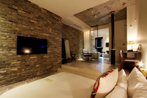Una televisión o centro de entretenimiento en Boutique Hotel Loft