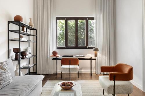 a living room with a table and a window at Pereh Mountain Resort in Gadot