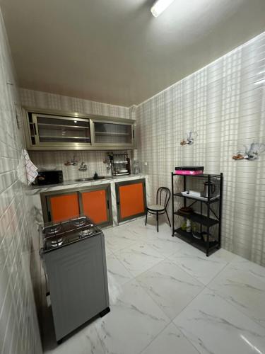 a kitchen with a stove and a counter top at Express at home in Dakar