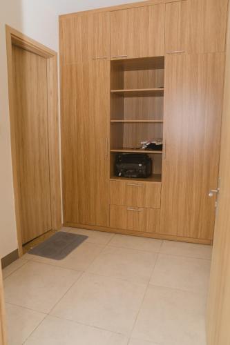 a room with a cabinet with a radio in it at Aria Seaside Apartment - Căn hộ nghỉ dưỡng 3PN sát biển in Vung Tau