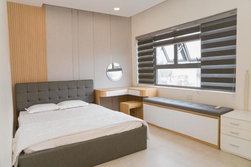 En eller flere senge i et værelse på Aria Seaside Hotel