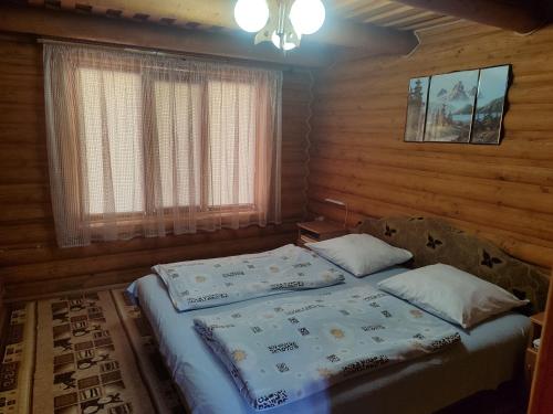 Postel nebo postele na pokoji v ubytování uoksany