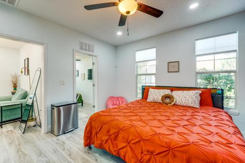 a bedroom with a bed and a ceiling fan at 2 Mi to Dtwn Jax Game-Ready Retreat with Yard in Springfield