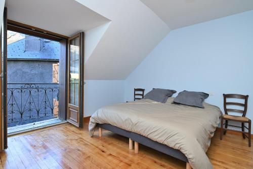 Ένα ή περισσότερα κρεβάτια σε δωμάτιο στο Gite à Cazaux - Bagnères de Luchon