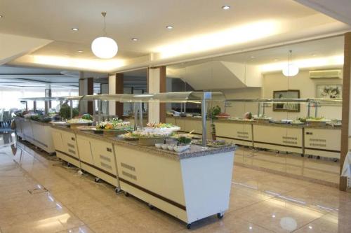 a kitchen with a counter with food on it at Lycus River Thermal Hotel in Pamukkale