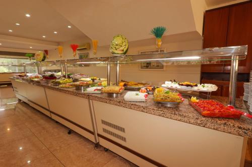 a buffet line with many different types of food at Lycus River Thermal Hotel in Pamukkale