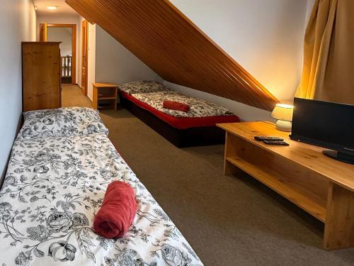 Postel nebo postele na pokoji v ubytování Penzion a restaurace U Zvonku