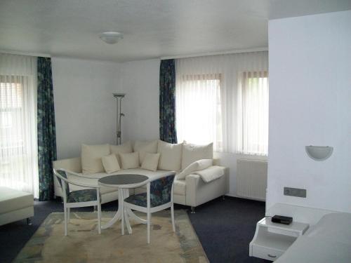 a living room with a couch and a table at Hotel Gasthof Traube in Kernen