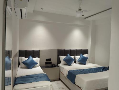 Postel nebo postele na pokoji v ubytování Hotel Palliate Inn