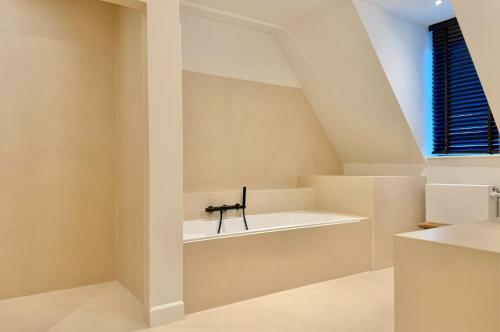 a room with a white shelf and a window at exceptional luxury villa near Knokke Golf in Knokke-Heist