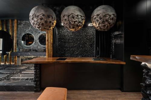 a bar in a restaurant with two large spheres at KADOR HOME HOTEL downtown in Kyiv
