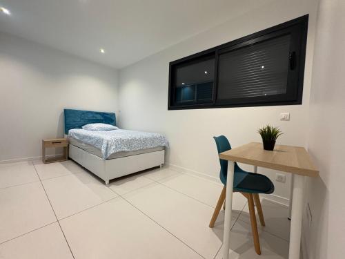 En eller flere senge i et værelse på Maison moderne Villa