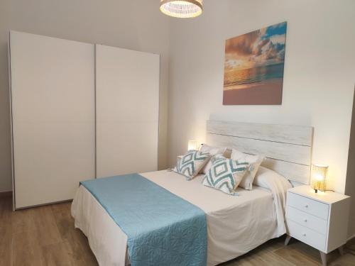 Giường trong phòng chung tại Villa el Mirador de la Axarquía