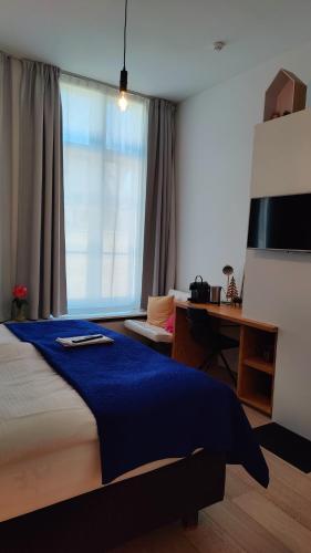 En eller flere senge i et værelse på b&b les invités