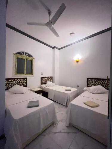 Ένα ή περισσότερα κρεβάτια σε δωμάτιο στο Masel guesthouse