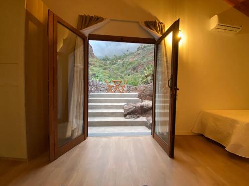 En eller flere senge i et værelse på Jacam Suite