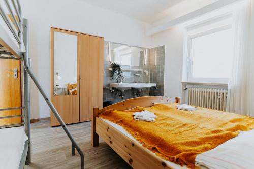 a bedroom with a large wooden bed in a room at Geräumige Ferienwohnung nah am Rhein & Marktplatz in Boppard