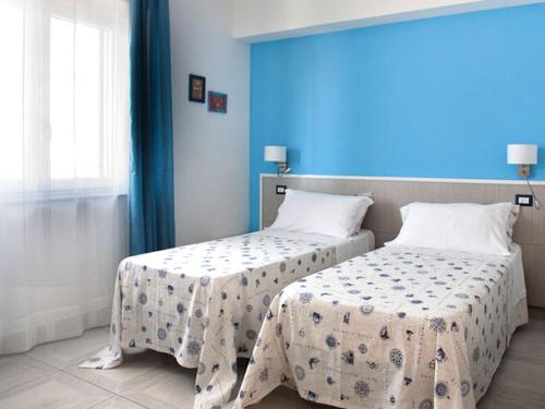 Postel nebo postele na pokoji v ubytování San Teodoro Living House