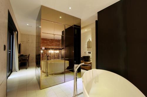 Una cama o camas en una habitación de Boutique Hotel Loft
