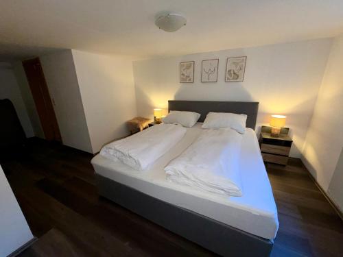 Postel nebo postele na pokoji v ubytování Design-Apartment im Zentrum von Scheidegg