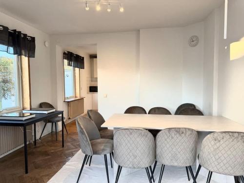 a dining room with a table and chairs at Workers Big Villa - 5 BR - 2 Bath - 10 min to Volvo in Gothenburg