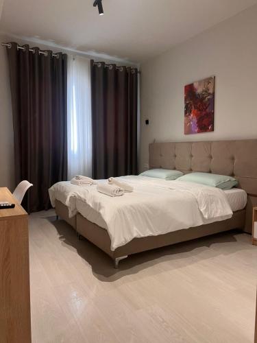 En eller flere senge i et værelse på TEN residences