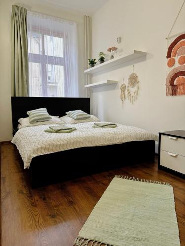 a bedroom with a large bed in a room at CenterPoint Apartment in Karlovy Vary