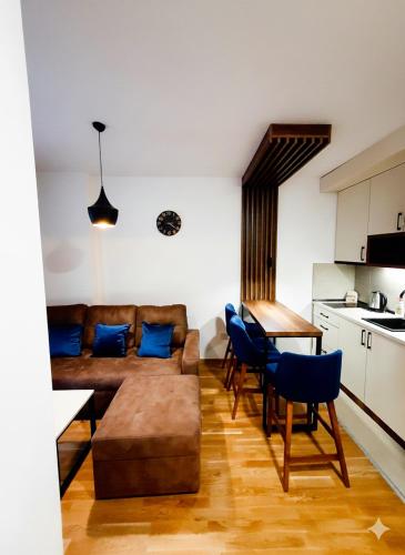 a living room with a couch and a table at Apartman Felicita 2 Zlatibor in Zlatibor