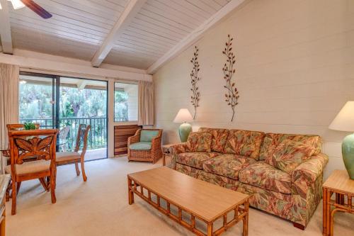 a living room with a couch and a table at Hono Kai C12 in Maalaea