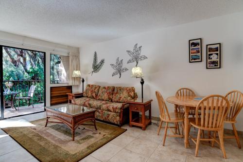 a living room with a couch and a table at Hono Kai B15 in Maalaea