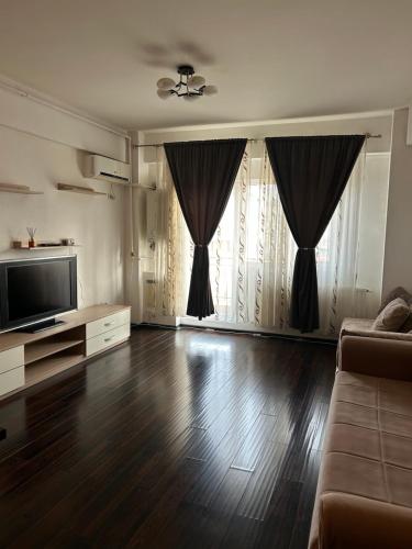 Een TV en/of entertainmentcenter bij Bella Home Apartment
