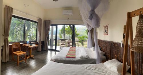 Ένα ή περισσότερα κρεβάτια σε δωμάτιο στο Pu Luong Ecostay